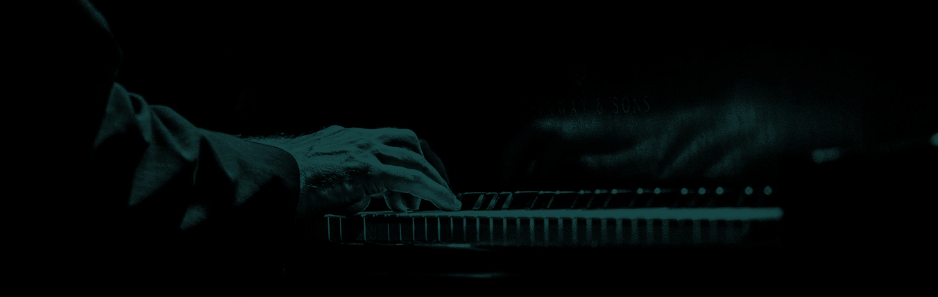 side view of Nick's hands on piano